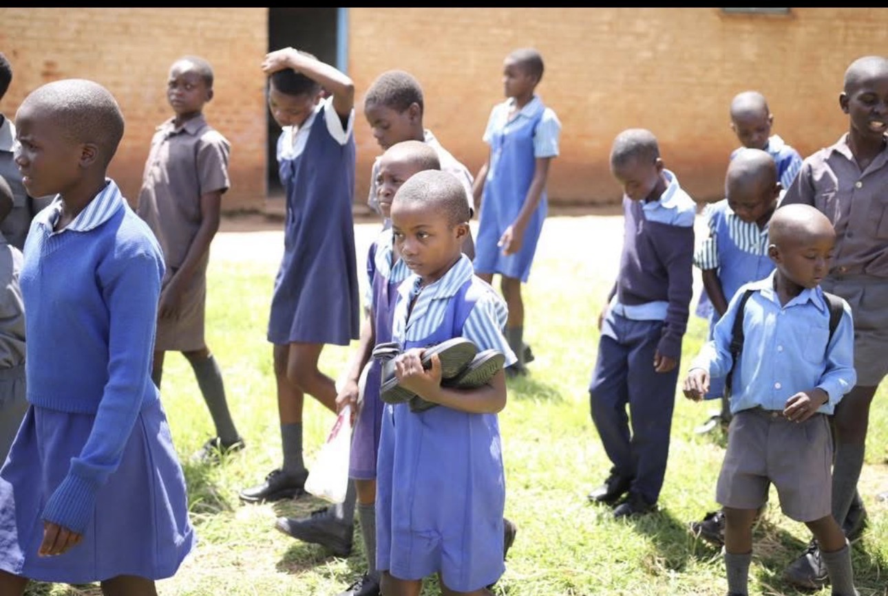 Children in school uniform featured in the Shiny School Shoe Campaign